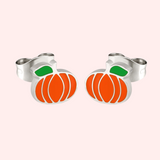 A pair of silver hypoallergenic earrings designed to resemble pumpkins with orange and green details.