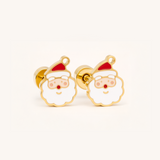 Gold Father Christmas Flat Back Style Earrings with a red hat on a light pink background.