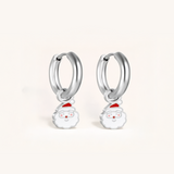 Silver hoop earrings with Santa face charms on a white background