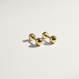 Ball hypoallergenic flat back stud earring in gold on white background