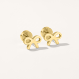 Bow hypoallergenic flat back stud earring in gold on white background.