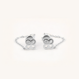 Clover-shaped silver bracelet on a white background