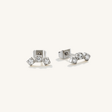 A pair of silver curved studs with 3 cubic zirconia pieces.