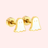 Ghost-shaped earrings on a light pink background