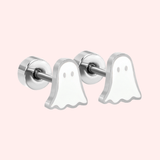 Ghost-shaped earrings on a light pink background