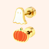 Gold Halloween-themed stud earrings with ghost and pumpkin designs on a beige background
