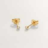 Mini CZ hypoallergenic stud earrings in gold on white background