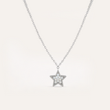 Star-shaped pendant necklace on a light gray background