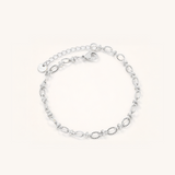 Silver bracelet on a white background.