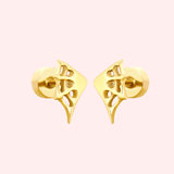 Pair of gold webbed earrings on a light pink background