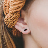 Bat Hypoallergenic Earrings in girls ear.