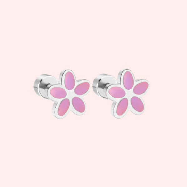 Pair of pink flower-shaped earrings on a light pink background