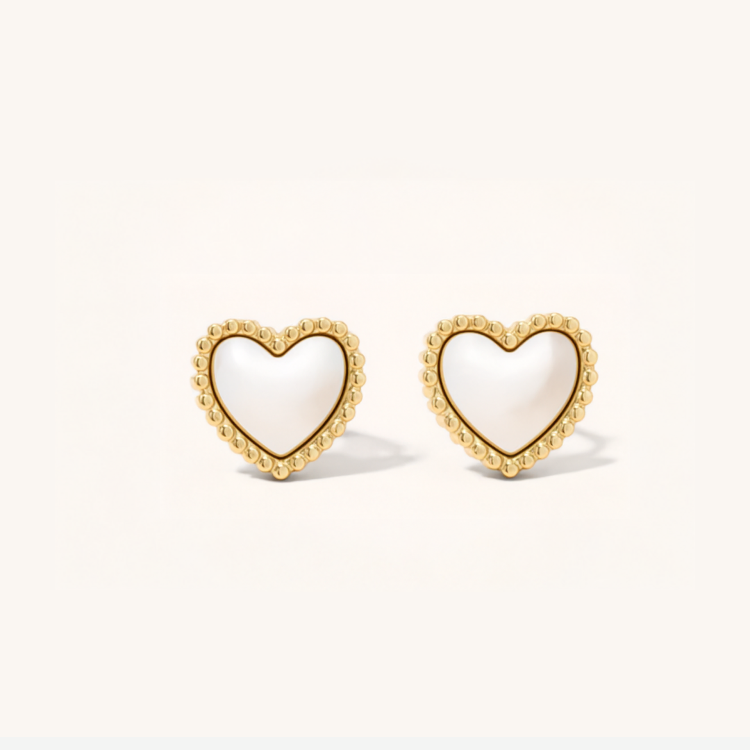 Heart-shaped earrings with gold rims on a white background