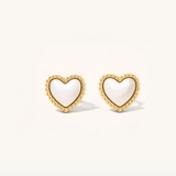 Heart-shaped earrings with gold rims on a white background