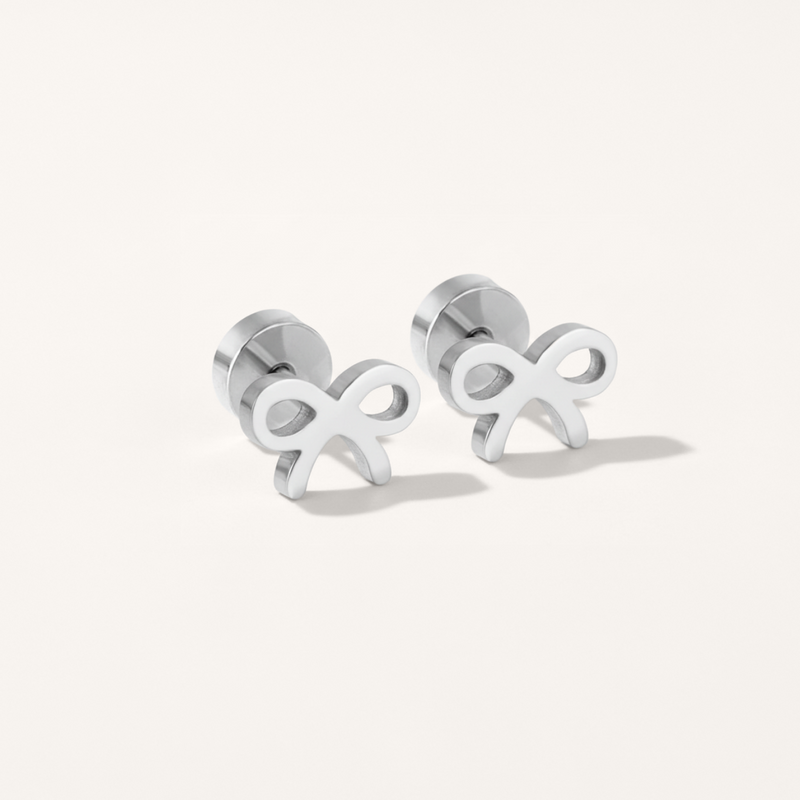 Bow hypoallergenic flat back stud earring in silver on white background