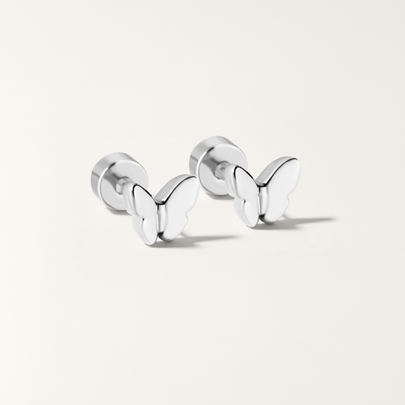 Butterfly hypoallergenic flat back stud earring in silver on white background
