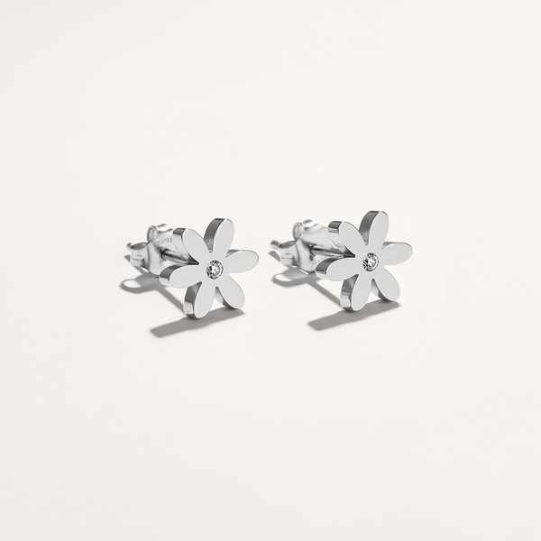 Silver flower-shaped earrings on a white background