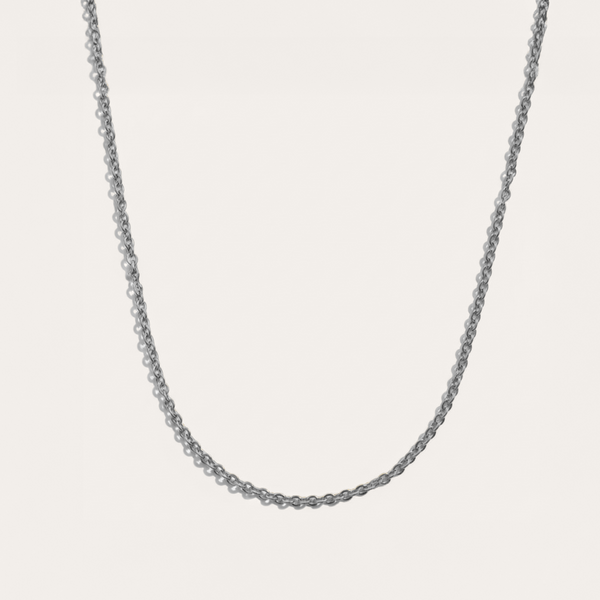 Delicate necklace in silver on white background

