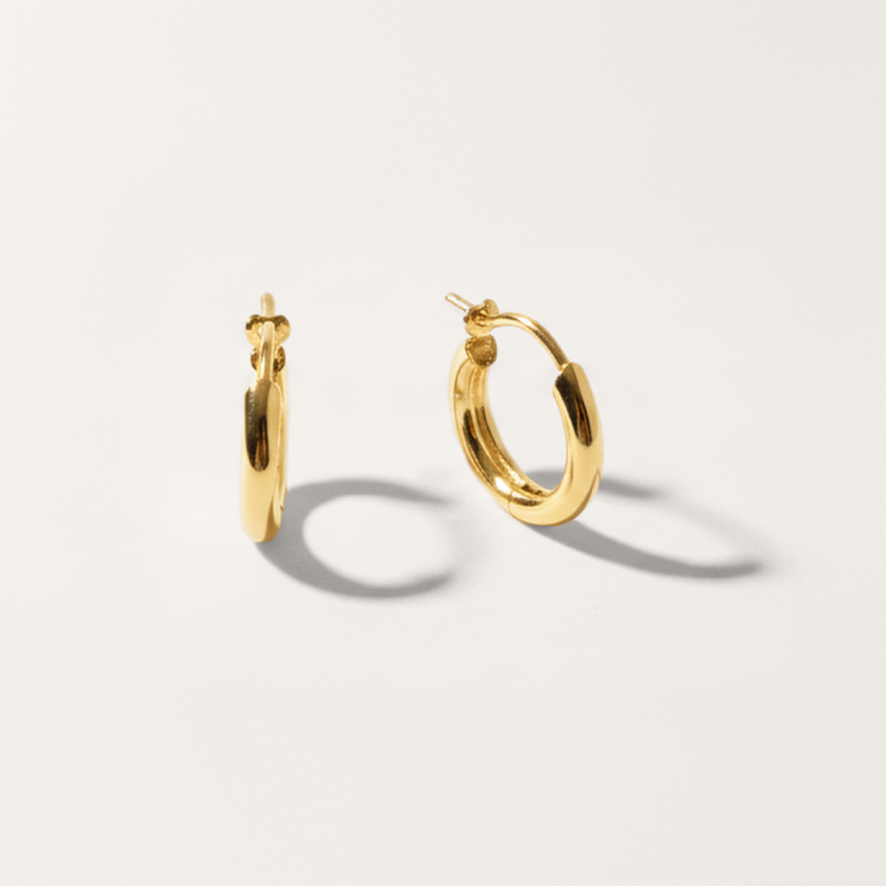 Everyday hoop hypoallergenic earrings in gold on white background
