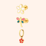 Set of three gold garden party themed earrings on a light pink background