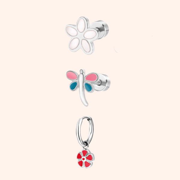 Set of three silver garden party themed earrings on a light pink background