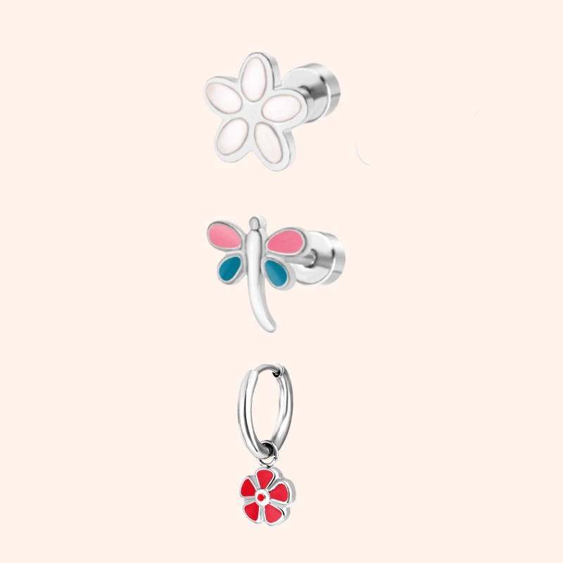 Set of three silver garden party themed earrings on a light pink background