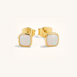 Gold square opal stud earrings on a white background