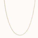 Gold chain necklace on a white background