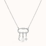 A silver carabiner necklace with charms on a white background.