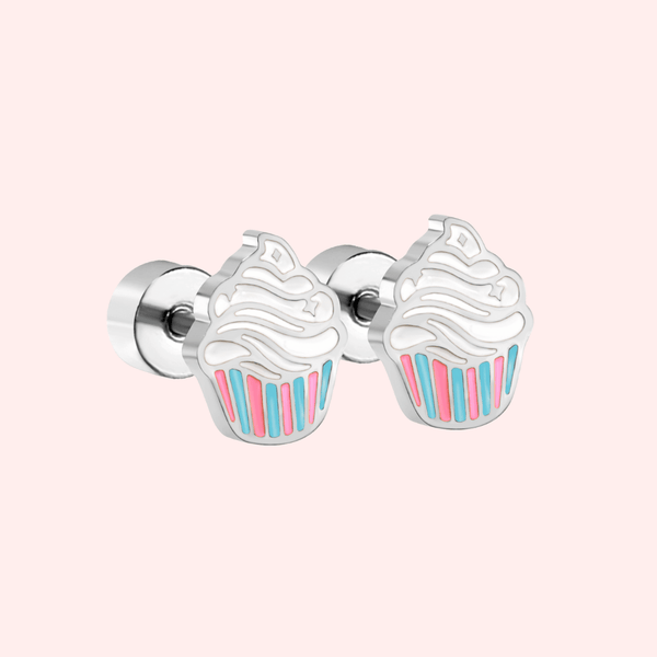 Silver cupcake-shaped earrings on a light pink background.