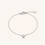Silver bracelet with a star-shaped charm on a white background
