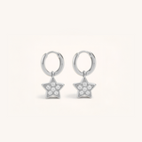 Silver star-shaped earrings with clear stones on a white background