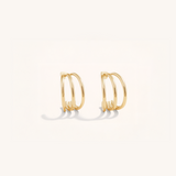 Gold hoop earrings on a white background
